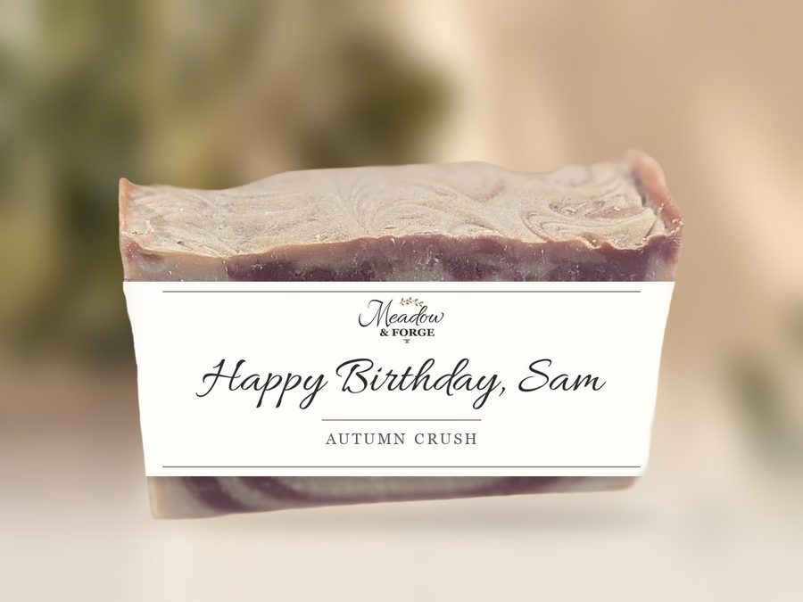 An Autumn Crush bar wrapped in a personalized band reading Happy Birthday, Sam